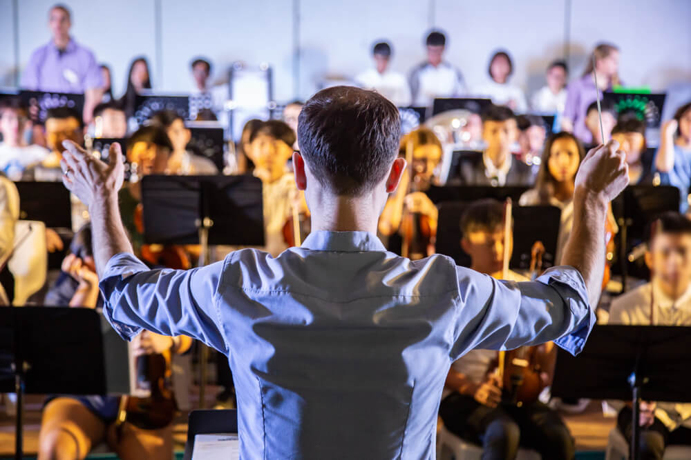 conductor orchestrating a band